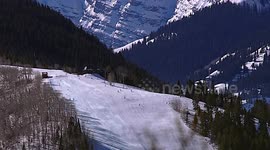 Colorado Skiing: Telephoto Lens Captures Skiers & Maroon Bells