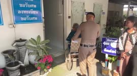 Wife of German train crash victim breaks down in tears as she collects her husband's body