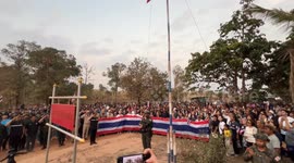 Thai soldiers lead flag-raising ceremony at village reclaimed from Cambodia during conflict