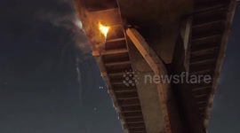 Fire breaks out on drainage pipes under bridge in Thailand