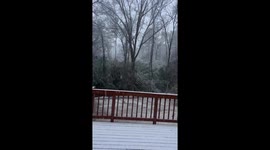 Snow blankets front deck of house in Georgia