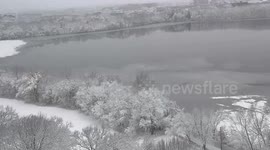 Snow transform lake in Massachusetts to beautiful white winter scene