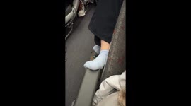 Tourists annoyed by passenger resting her feet on seat