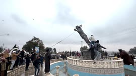 People in Tabqa demolish statues placed by SDF and seen as symbols of the terrorist organization