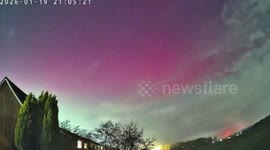 Vivid green and purple Northern Lights seen over homes in Lancashire