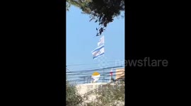 Israel: Israeli Flag Raised Over UNRWA Headquarters in Jerusalem During Demolition