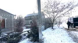 Drone attack aftermath in the suburbs of Odesa, Ukraine. Footage shows destroyed private homes, fire damage and emergency services working at the scene after Russian drones were intercepted, with debris causing fires and destruction in a residential area.