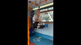 Girl Hanging on Her Hair on a Bus