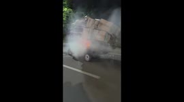 Dramatic moment pile of cardboard on moving tricycle catches fire as rider smokes