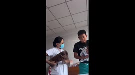 Nervous new dad frozen in fear while holding baby for first time