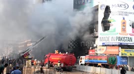 At least six people die after huge shopping centre fire in Pakistan