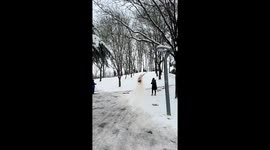 Woman’s snowy slide ends in collision with streetlight pole in Henan, China