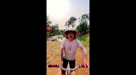 Daredevil attempts to cycle across extremely narrow 'monkey bridge'