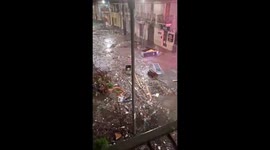 Storm surge sweeps debris into streets in Italy