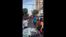 Residents halt traffic to play hanging loot game dangling on live electrical wires