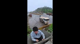 Worker squeezes himself inside concrete mixer to manually clear two tonnes of debris