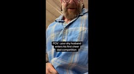 Shy husband delights crowd with hilarious dance routine during daughter's cheerleading contest