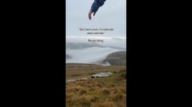 Joyful Hiker turns Cartoon Slip on a Rock