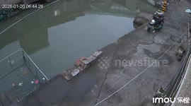 Elderly woman riding electric scooter crashes into canal before residents rescue her