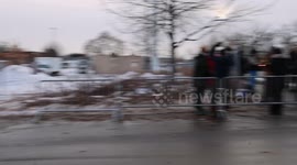 Anti-ICE Protestorin front of the entrance of the ICE detention facility at the Whipple Federal Building in Minneapolis