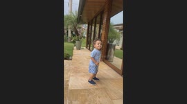 Kid Runs Into Trash Can and Falls Over