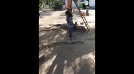 Playful attempt to hit a hanging bottle in Caracol, Guasave, Mexico