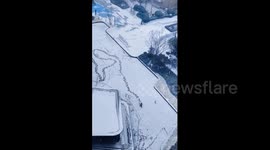 China: Chinese man joyfully creates patterns in snowy courtyard