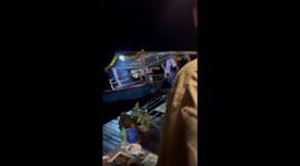 Food vendor leaps from sinking boat as it hits raft hotel