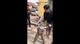 Bladesmith couple forge steel shovel creating rhythmic sounds