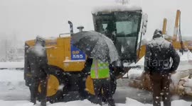 Continuous snowfall wraps roads under thick white blanket as heavy machinery races to restore movement in Kashmir Valley