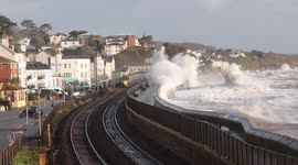 This footage shows violent Storm Ingrid and Atlantic waves crashing over the famous Dawlish sea wall, with mainline trains continuing along Brunel’s coastal railway as sheets of water slam into the carriages. Several wave impacts were so forceful that sea