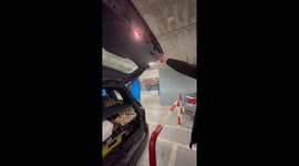 Car trunk closes with perfect clearance beside barrier in Belgrade, Serbia