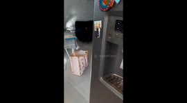 Toddler enjoys thrifted rocking chair, Tucson, Arizona, USA