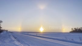 produce beautiful sun, dogs below zero temps in Minnesota produce beautiful sun, dogs