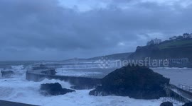 Storm Ingrid lashes the lighthouse at Mevagisssy, Cornwall