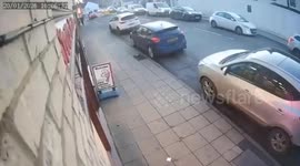 Moment car mounts pavement during police chase