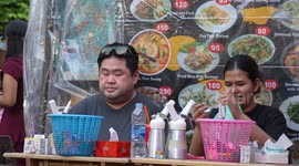 Nitrous oxide laughing gas seen widely available on backpacker party street Khao San Road in Thailand