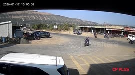 India: Truck overturns while trying to save a biker