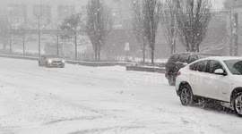 New York: Vehicle travel through falling snow on the West Side Highway