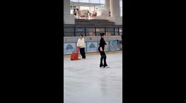 Woman slips and falls during skating attempt at rink in Guangdong, China