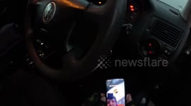 Funny moment locksmith traps himself in customer's car and has to be rescued