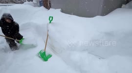 Heavy snow buries homes and cars in fresh ice in Sapporo