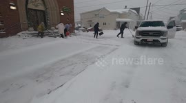 Kulpmont firefighters out shoveling snow at the church