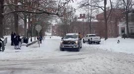 Pickup Truck Pulls Skier Through Snowy Streets Near Ohio University
