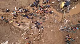 Death toll at 10 as search continues for more than 80 missing in Indonesia landslide