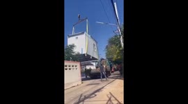 Crane drops prefab summer house onto family's home