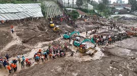Indonesia landslide search teams continue to recover bodies from the mud