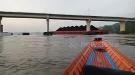 Barge carrying coal crashes into bridge in Indonesia