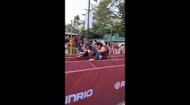 Crowd cheers as runners help grandmother cross marathon finishing line