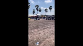 Dozens of tuk-tuks race across off-road track in Cambodia